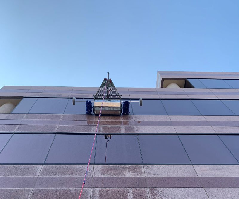 Premium Photo  Window cleaning in high-rise buildings, houses with a  brush. window cleaning brush. large window in a multi-storey building,  cleaning service. dust removal and glass washing.